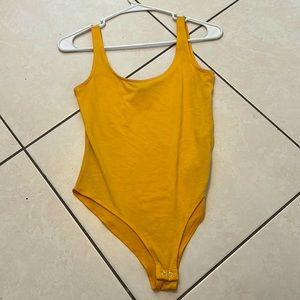 Yellow body suit